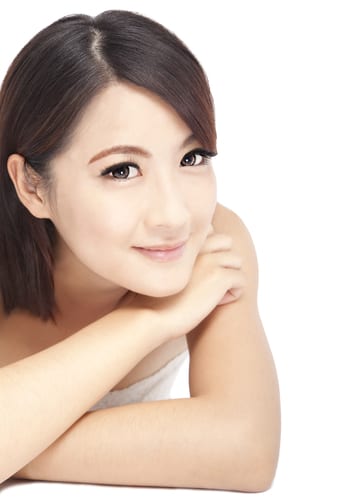 Woman resting her chin on her hand